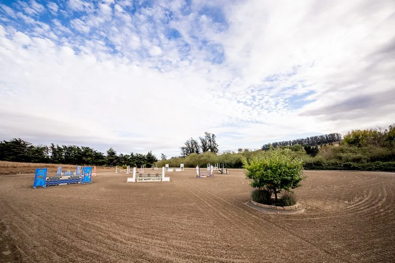 Outdoor jumping arena with a course set at Jaz Creek