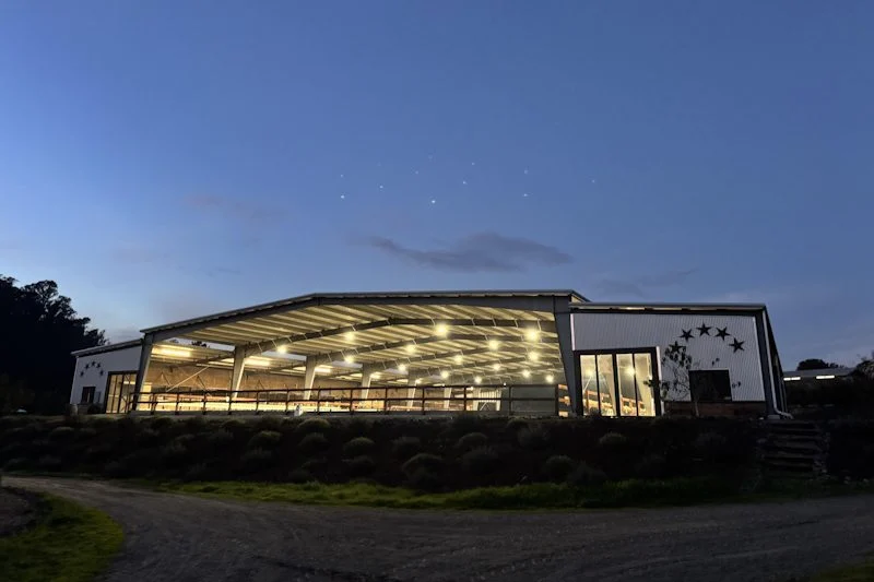 Covered arena lit at night