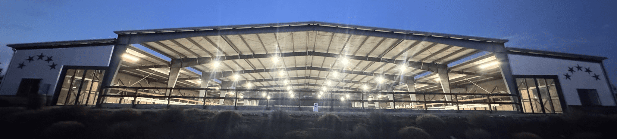 Jaz Creek covered arena lit at dusk