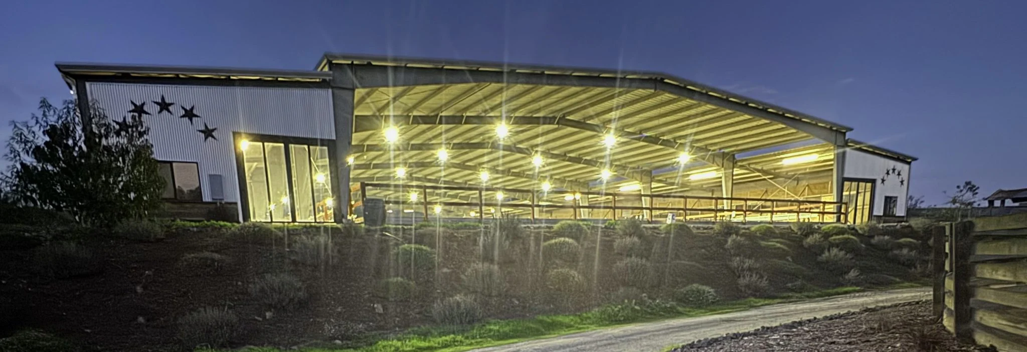Jaz Creek covered arena complex at dusk